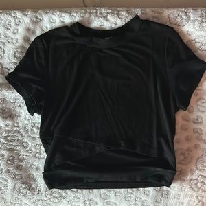 Black, short sleeve, top with a slit in the middle
